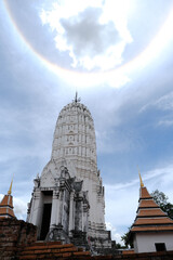 Ancient main prang and sun halo at Wat Phutthaisawan, Ayutthaya Historical Park, Thailand