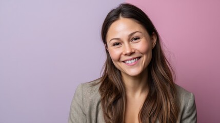 Fototapeta premium Professional smiling office worker woman, aged 30-35, in pastel-themed studio portrait. 