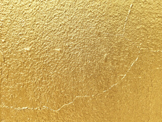 Gold Paint on Crack Concrete Wall Texture Background.