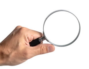 Hand holding a magnifying glass, with the lens pointed towards the viewer