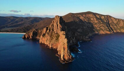 Aerial view of a rugged coastline at sunset