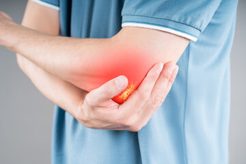 Diseases of the elbow joint, bone fracture and inflammation, man suffering from pain in cubit
