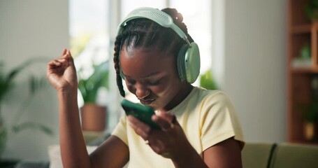 Dance, music and phone with black woman on sofa for streaming service, song playlist and energy. Headphones, audio subscription and connection with person in living room of house for radio and album