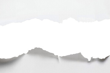 Torn Paper Revealing White Background With Rough Edges and Textured Surface