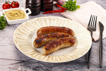 Delicous natural roasted sausages in the plate