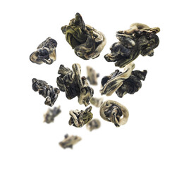 Dried Oolong tea levitates on a white background
