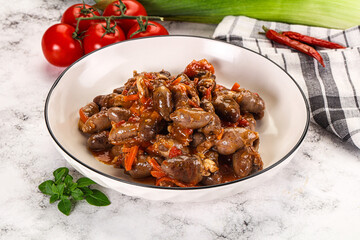 Baked chicken hearts with vegetables