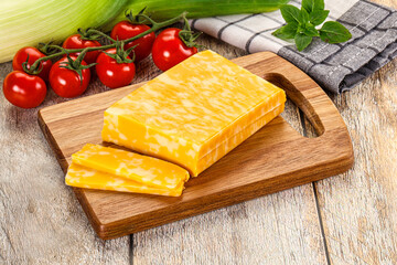Marble yellow cheese with slices