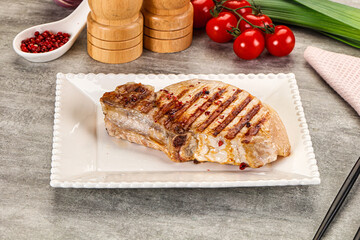 Grilled pork loin steak with bone
