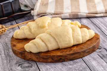 Raw uncooked croissant for bake