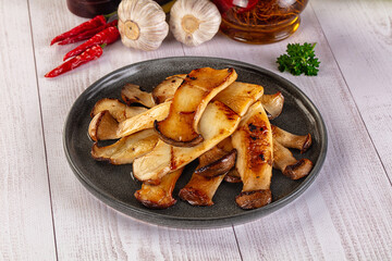 Roasted eringi mushrooms in the plate