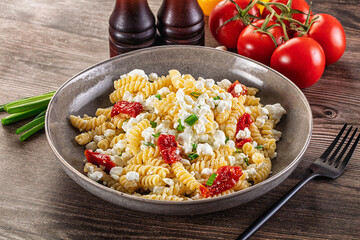 Italian pasta fusili with curd