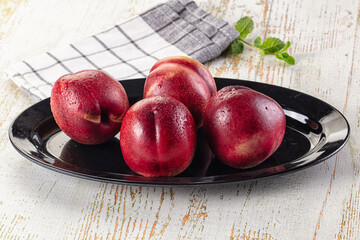 Ripe sweet juicy nectarines heap