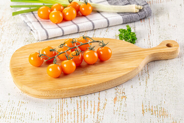 Ripe juicy yellow cherry tomatoes