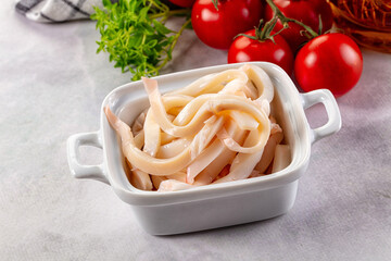 Canned marinated squid rings heap