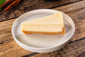 Classic delicous cheesecake slice served mint