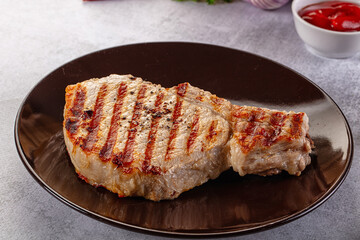 Tasty hot grilled bone steak served sauce