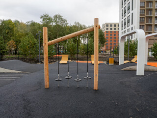 Abstract close-up of a modern building's architectural elements, featuring intersecting lines and geometric forms.