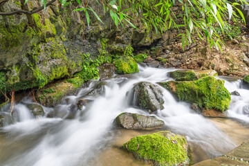 Waterfalls and streams among green mountains and clear waters in Guizhou Xiaoqikong Scenic Area