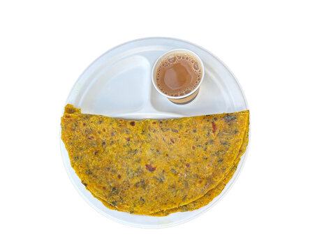 Indian paratha with masala tea. Layered flat bread with greens, hot naan, roti or chapati