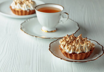 Meringue tart on a white table.