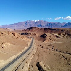 Naklejka premium Desert road to mountain range