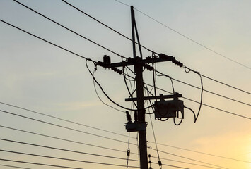 High voltage electric power lines and pylons against a blue sky