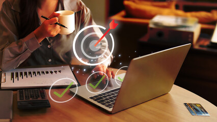 Business professional achieving project goals strategizing success online using laptop for financial growth and planning.