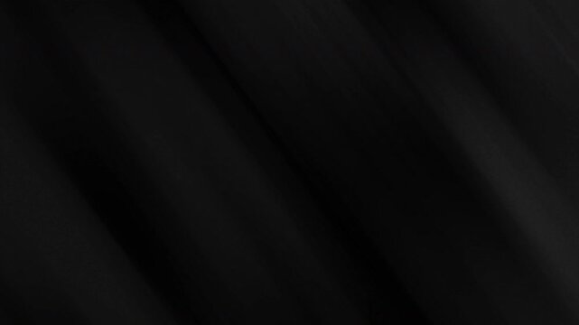Dark textured fabric with rich folds and shadows ideal for dramatic backgrounds or fashion design projects with a moody feel. Black Friday