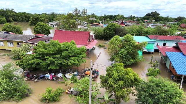 30,Sep,2025,Sena Ayutthaya, a storm and heavy rain caused water to overflow from the river and flood houses along the river called Mae Nam Noi in the rural area of Ayutthaya, Thailand.