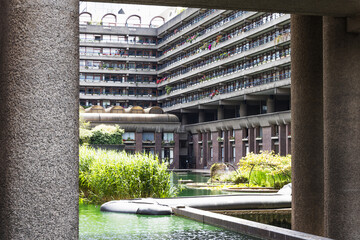 Barbican Estate London Brutalist Architecture with Pond and Lush Urban Garden
