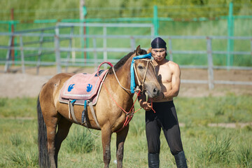 Mongolian actors practicing horse riding in the grassland scenic area