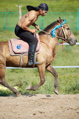 Obraz premium Mongolian actors practicing horse riding in the grassland scenic area