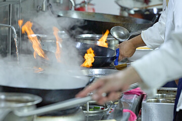 People and food Chefs in a busy Chinese kitchen