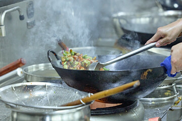 People and food Chefs in a busy Chinese kitchen