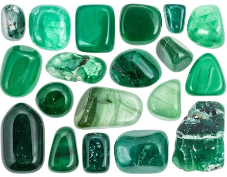 Assortment of polished, vibrant green gemstones scattered against white