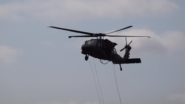 Military helicopter UH-60 in flight