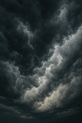 Obraz premium Towering storm clouds fill the frame, promising rain and a dramatic sky view.