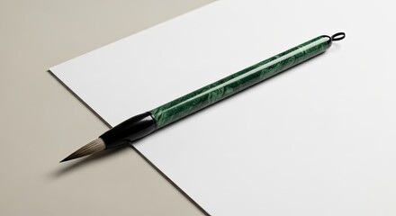 Traditional Chinese Calligraphy Brush Resting on White Paper