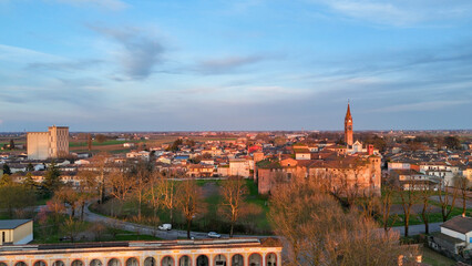 Sunset panorama of Monticelli d'Ongina a charming Italian town featuring a historic rocca...