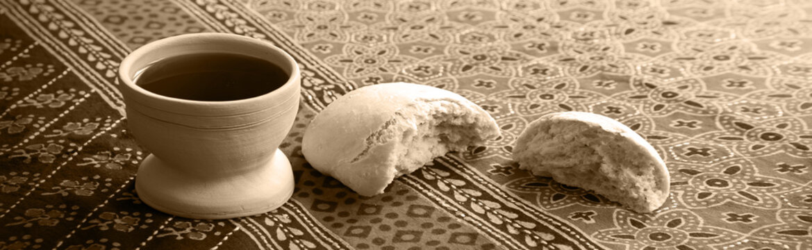 Wine in a gobled and bread