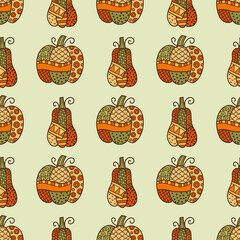Seamless patchwork pumpkin vector pattern in orange and green tones