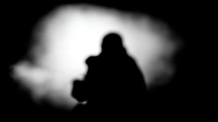 Silhouette against bright background creating a dramatic black and white composition