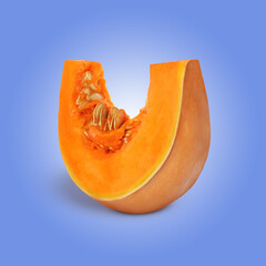 Slice of ripe pumpkin on blue background. Fall vegetable