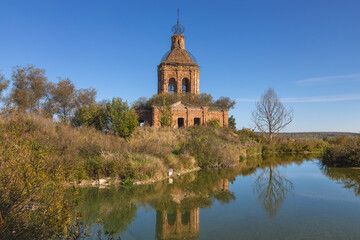 Ruins of Transfiguration Church in Zherdevo, Tula region, reflected in water