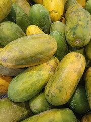 Pile of Fresh Ripe and Unripe Green Papayas