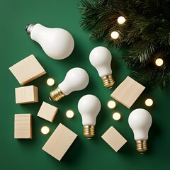 Creative christmas flat lay with light bulbs, wooden blocks on green background