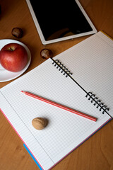 Creative workspace with fresh apple, blank notebook, and pencil