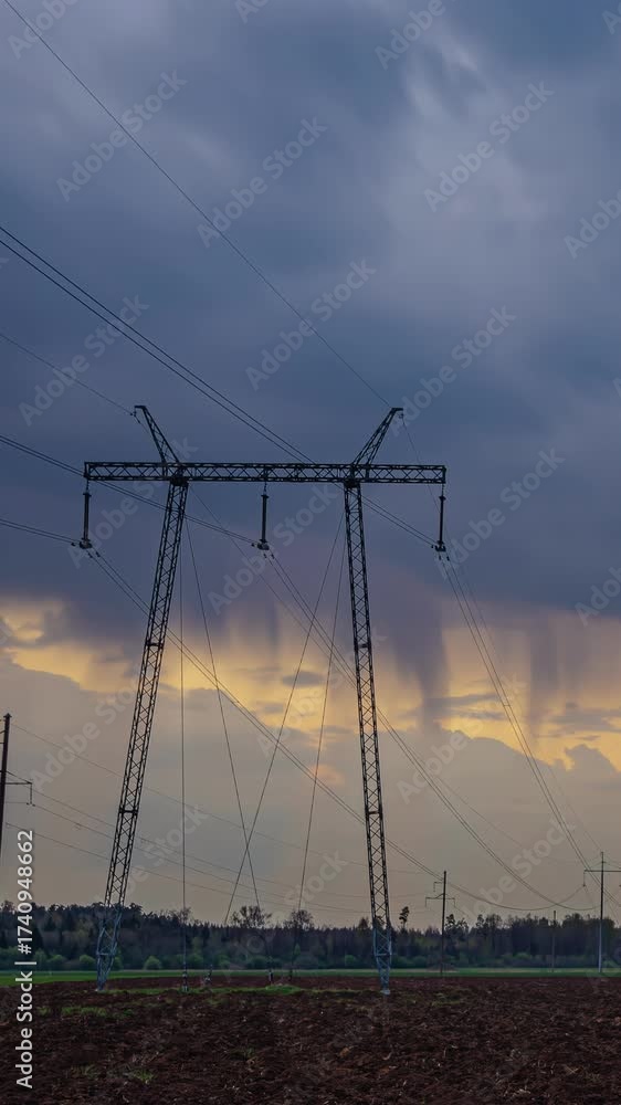 Wall mural dramatic skyline with power lines during changing weather in timelapse