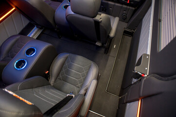 Comfortable interior of a passenger bus with soft seats